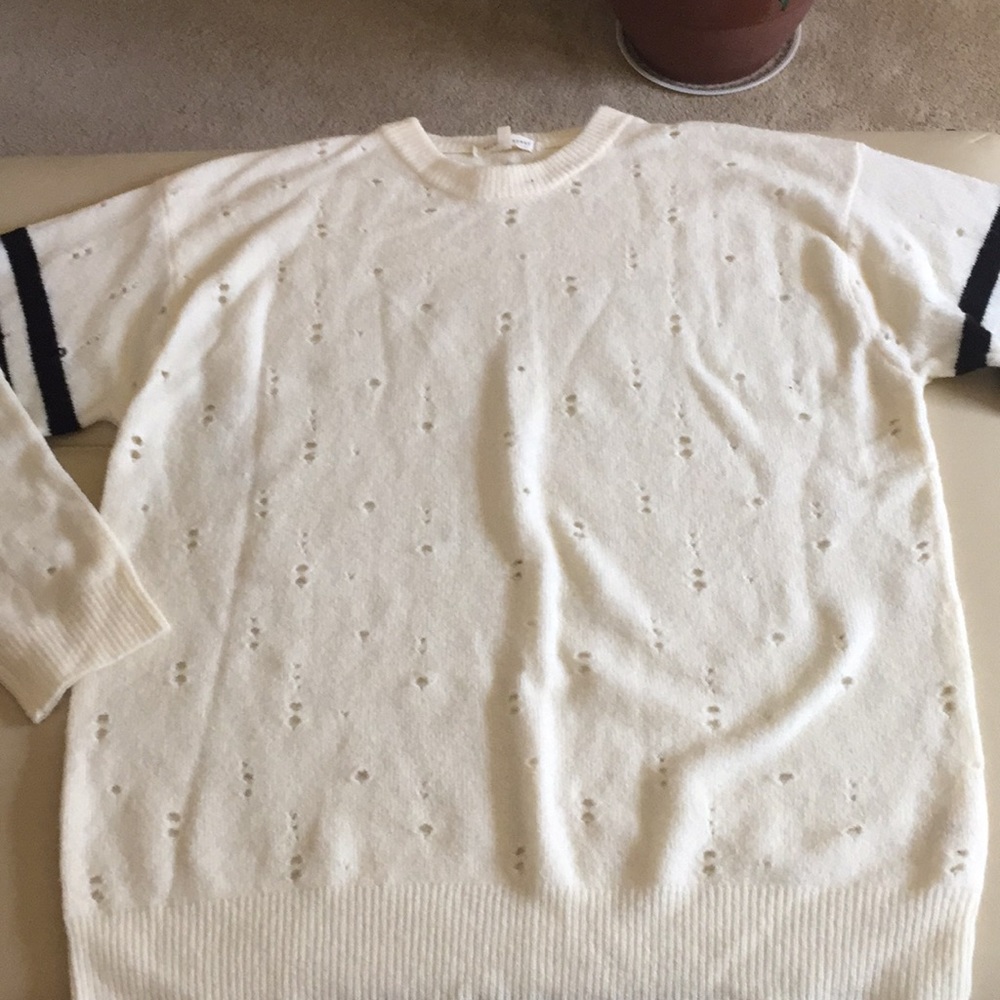 Large Gilded Intent ivory sweater.
